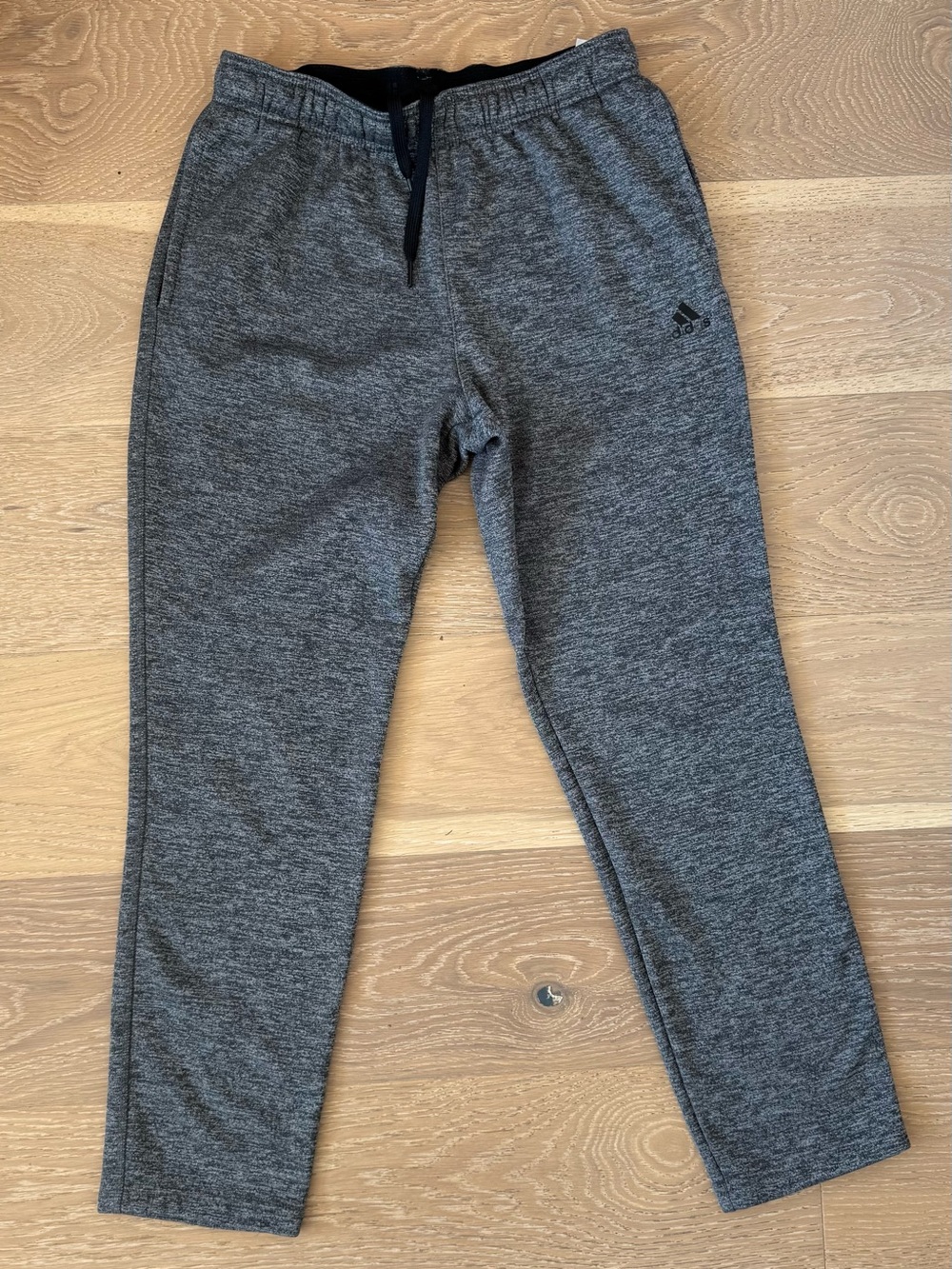 adidas Grey Climawarm Joggers With Fleece Lining And Pockets.